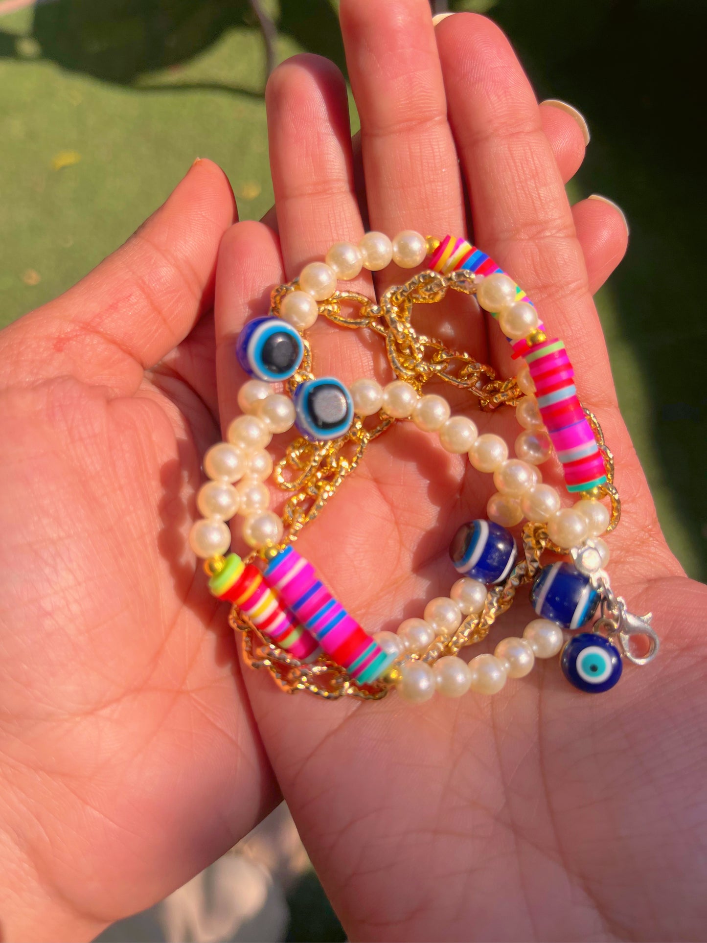 Evil eyes pearl multicolored bracelet